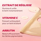 Masque éclat Vitamine C en cours de pose sur le visage