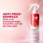 Glattes glänzendes Haar nach Anwendung des Haarsprays